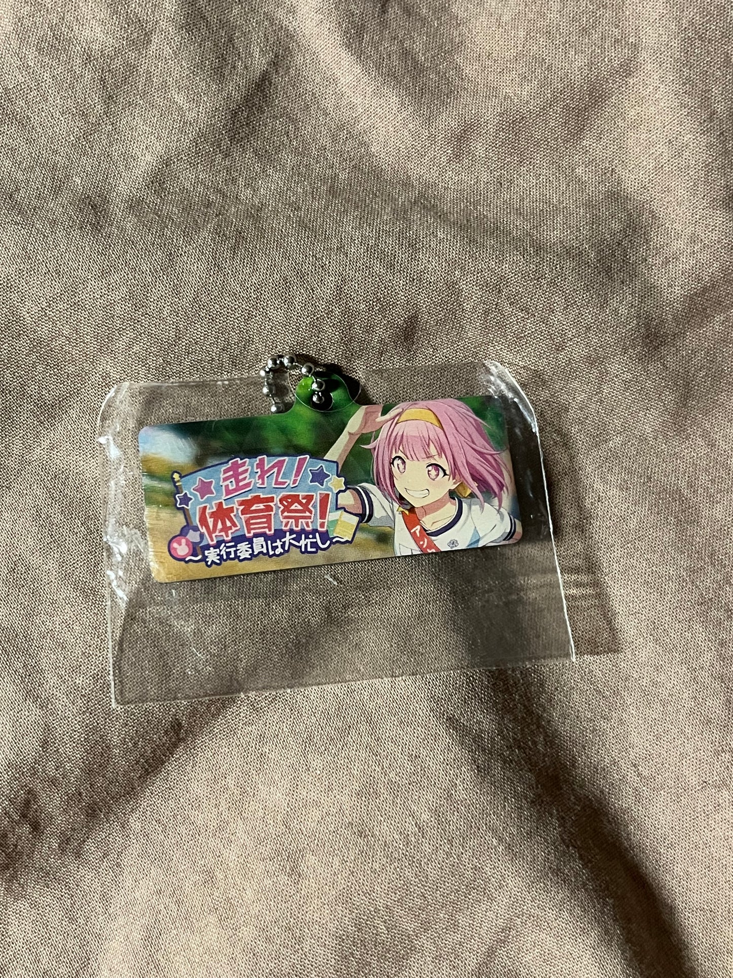 Project Sekai - Emu Otori “Run! Sports Festival! ~The Executive Committee is Very Busy~” Metal Event Keychain [UNTRAINED]