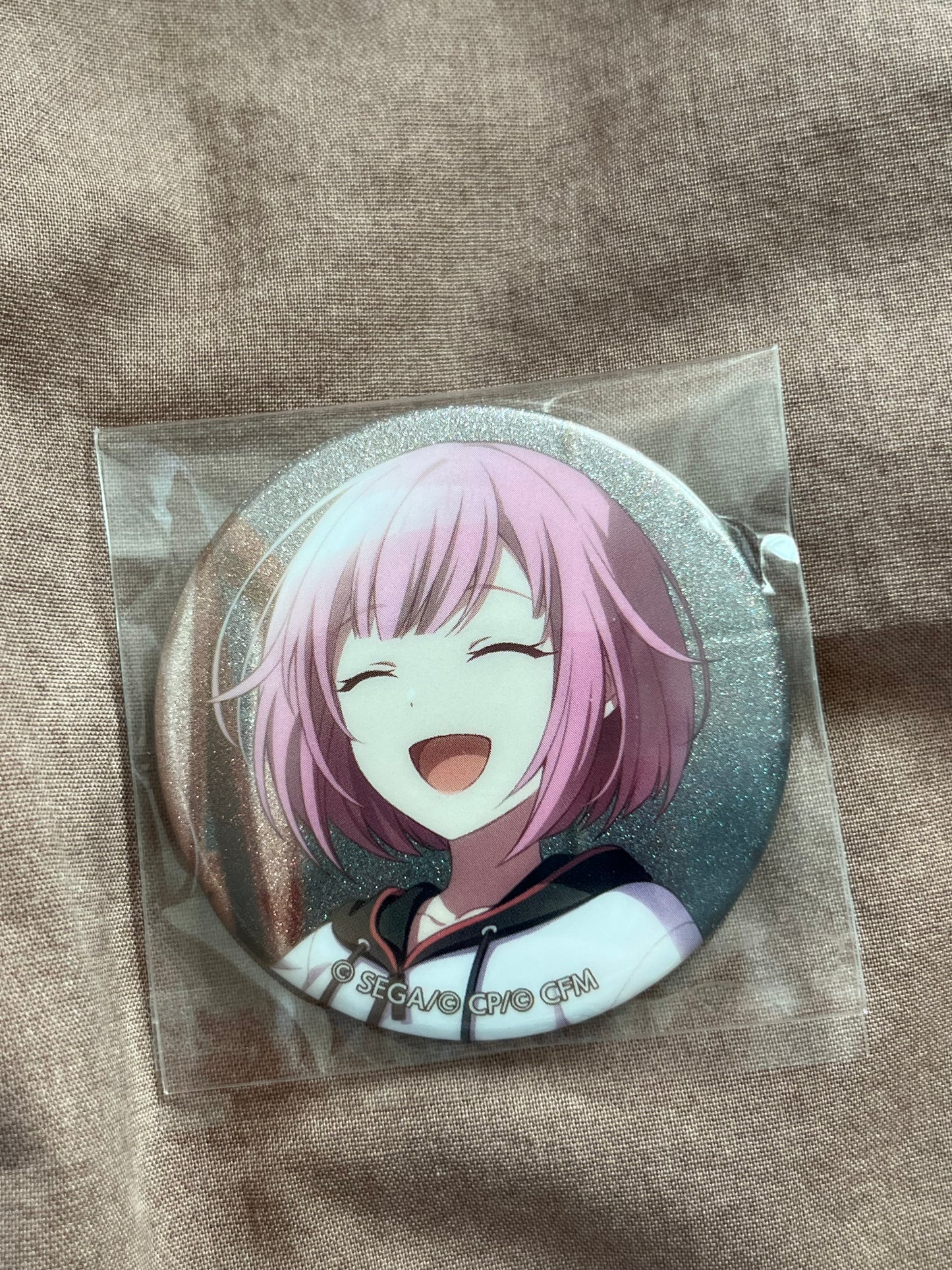 Project Sekai - Emu Otori "The Song of a Canary in Crisis" Glitter Badge [UNTRAINED]