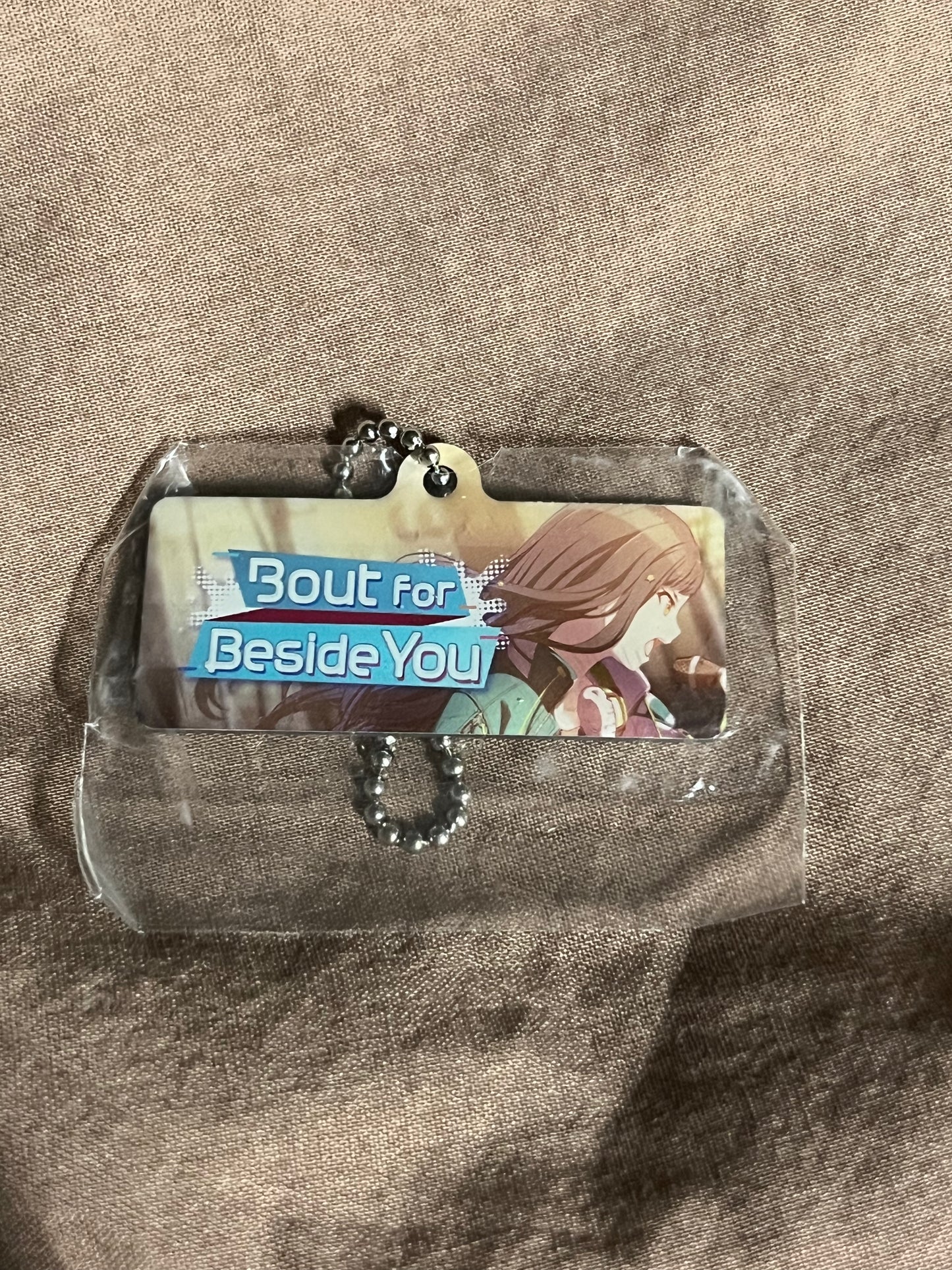 Project Sekai - An Shiraishi "Bout for Beside You" Metal Event Keychain [UNTRAINED]